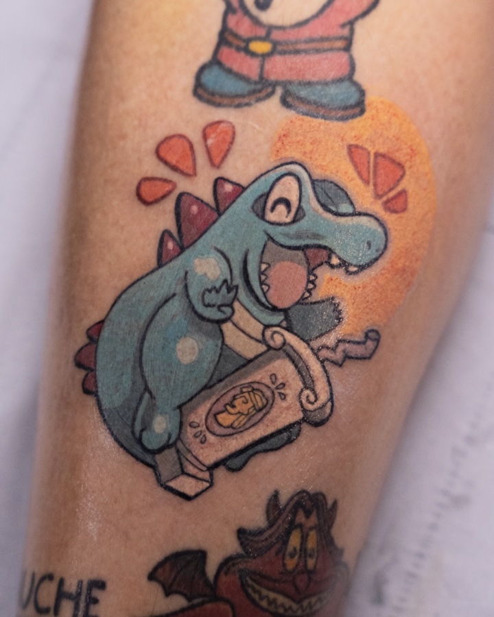 Tatouage de Kaiminus de Pokémon en style cartoon par Coyote