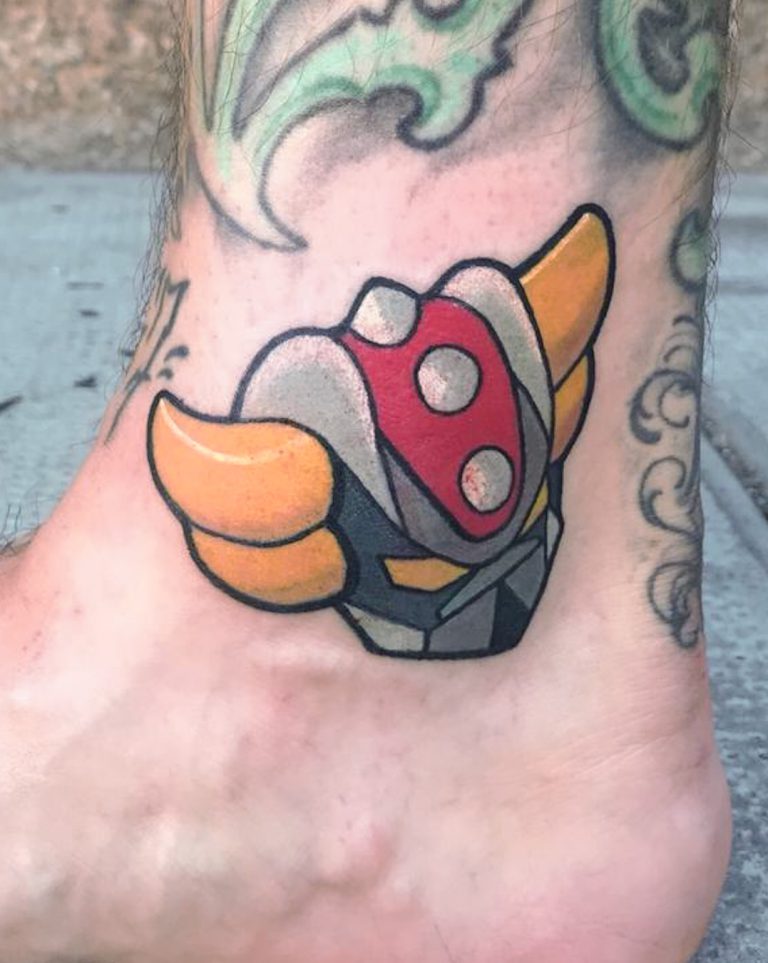 Tatouage Goldorak réalisé par Coyote, tatoueuse à Genève, style cartoon